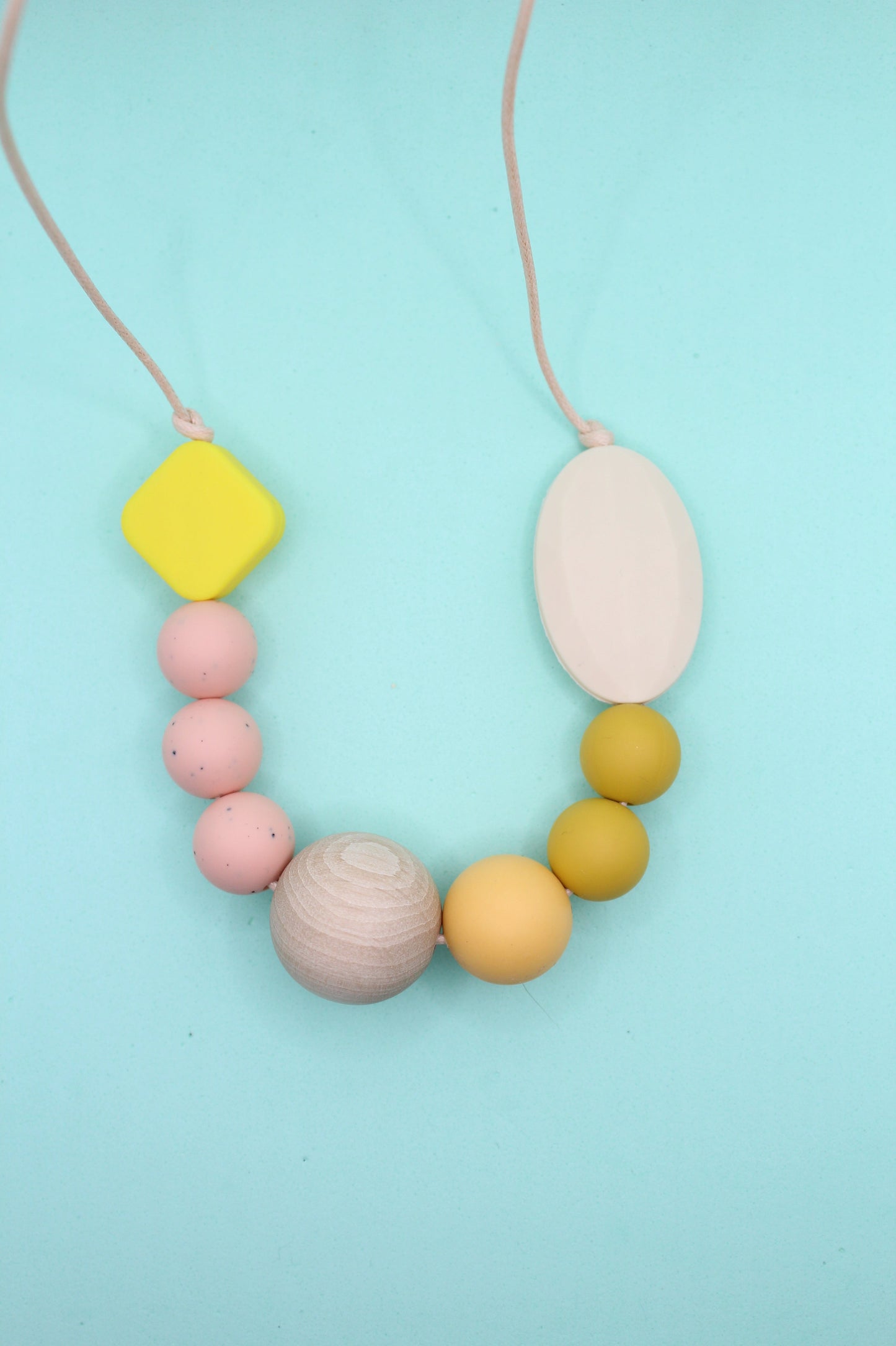 Mixed bead silicone sensory necklace for ADHD and autistic adults to fiddle or chew.