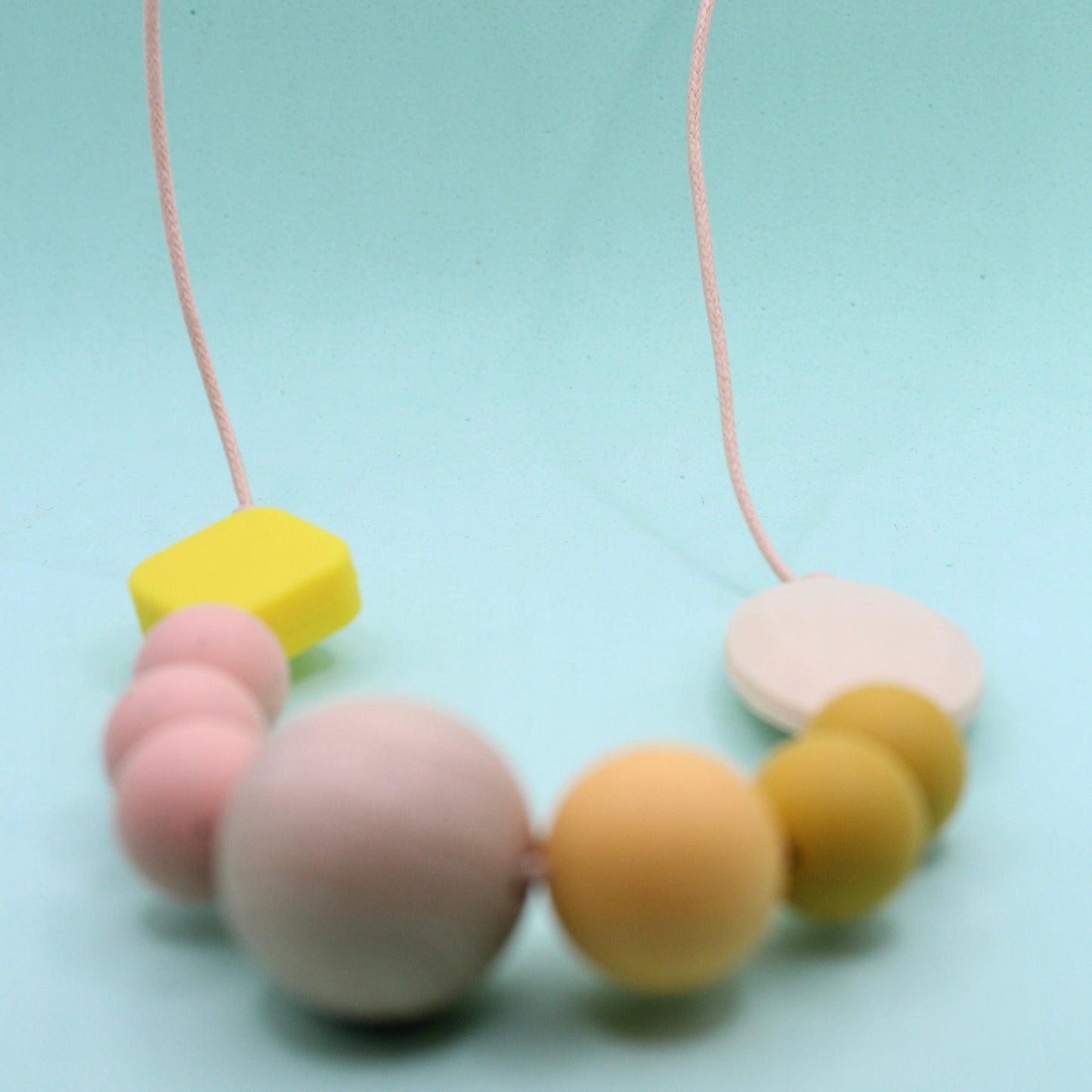 Mixed bead silicone sensory necklace for ADHD and autistic adults to fiddle or chew.