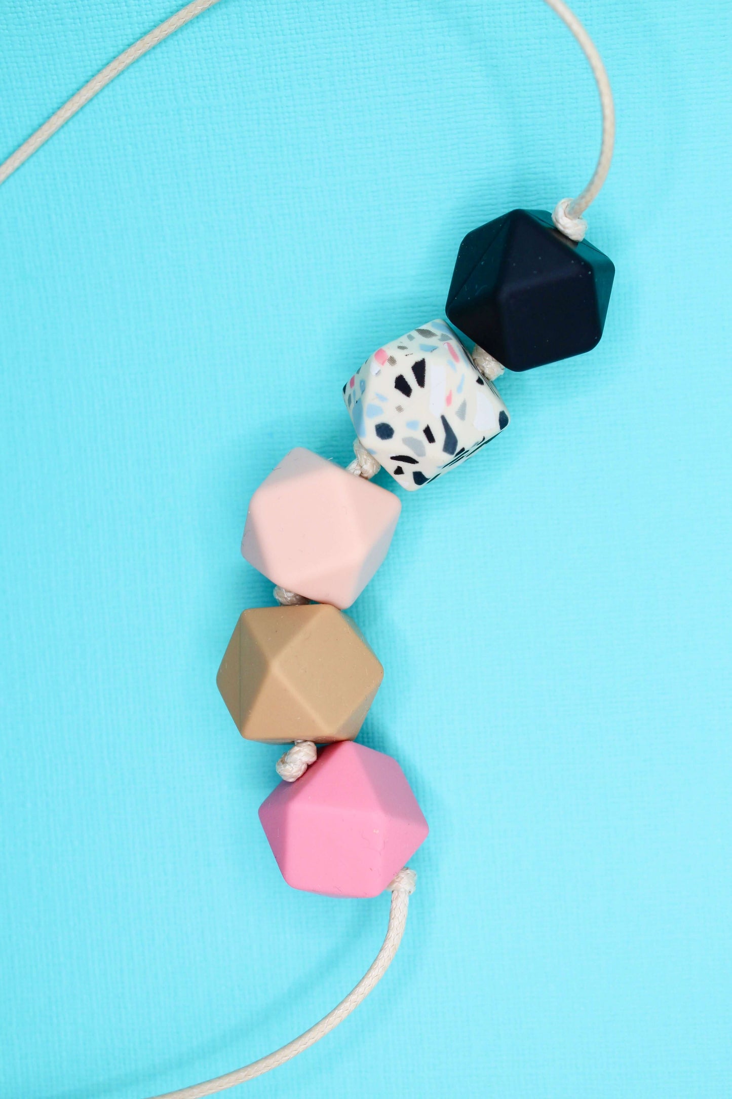 Hexagon silicone necklace with multi-color beads on cream cord, baby-friendly, suitable for ADHD and Autistic adults, sensory necklace.