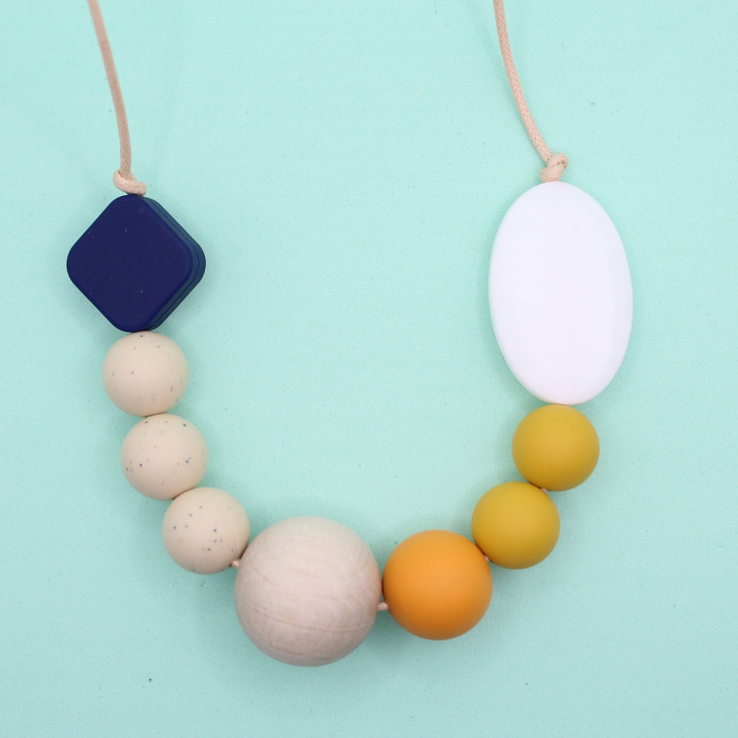 Navy and mustard silicone beaded necklace with sensory-friendly design and chewable beads for adults, ideal for autism-friendly use.