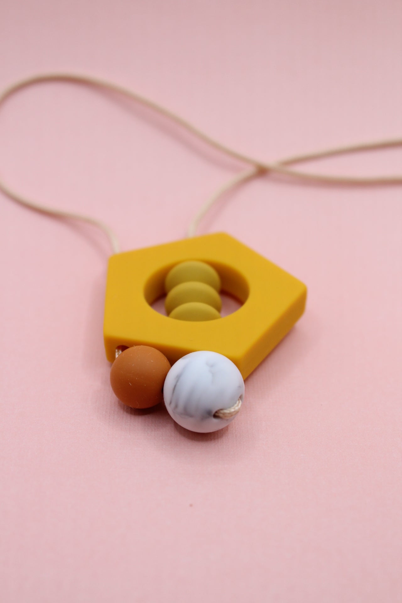 'Penny' Amber Yellow Pentagon Silicone Pendant Necklace - Mustard, Burnt Orange and Marble