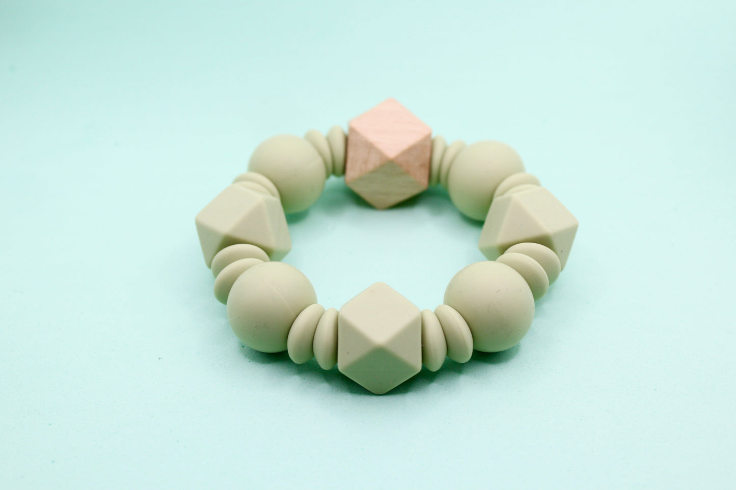 Silicone and Natural Wood Teether Ring in Lint, Pastel Blue, Peachy and Sienna