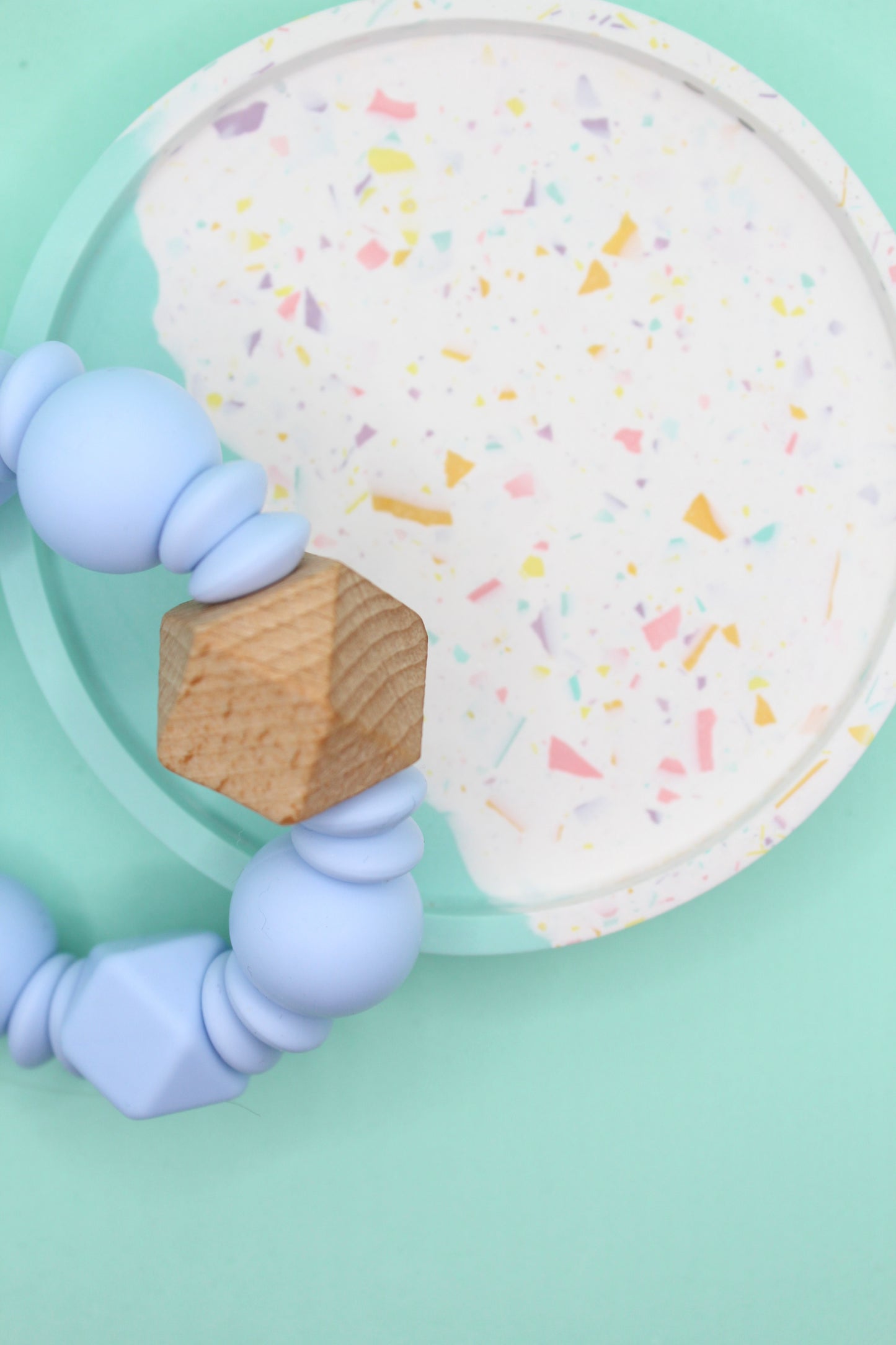 Silicone and Natural Wood Teether Ring in Lint, Pastel Blue, Peachy and Sienna