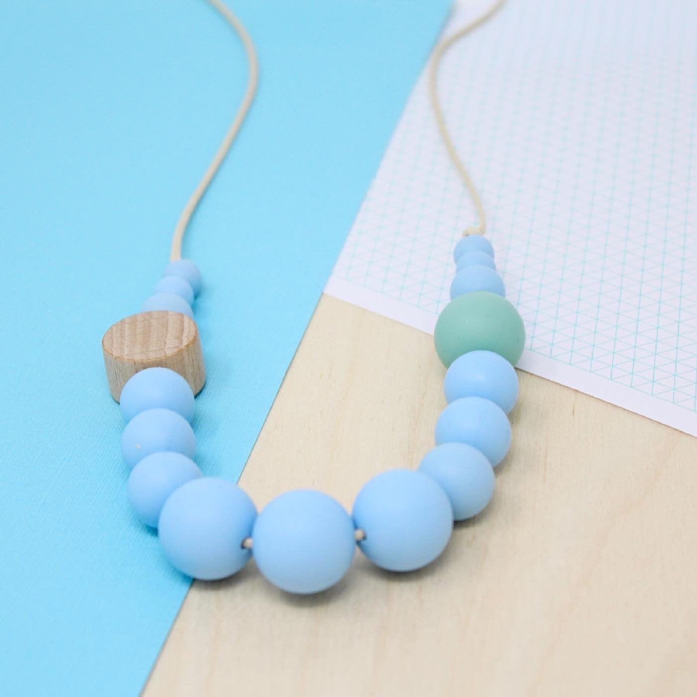 Silicone beaded necklace in aquamarine blue, neurodivergent and baby friendly for use sensory seeking and safe for use as teething and feeding jewellery.